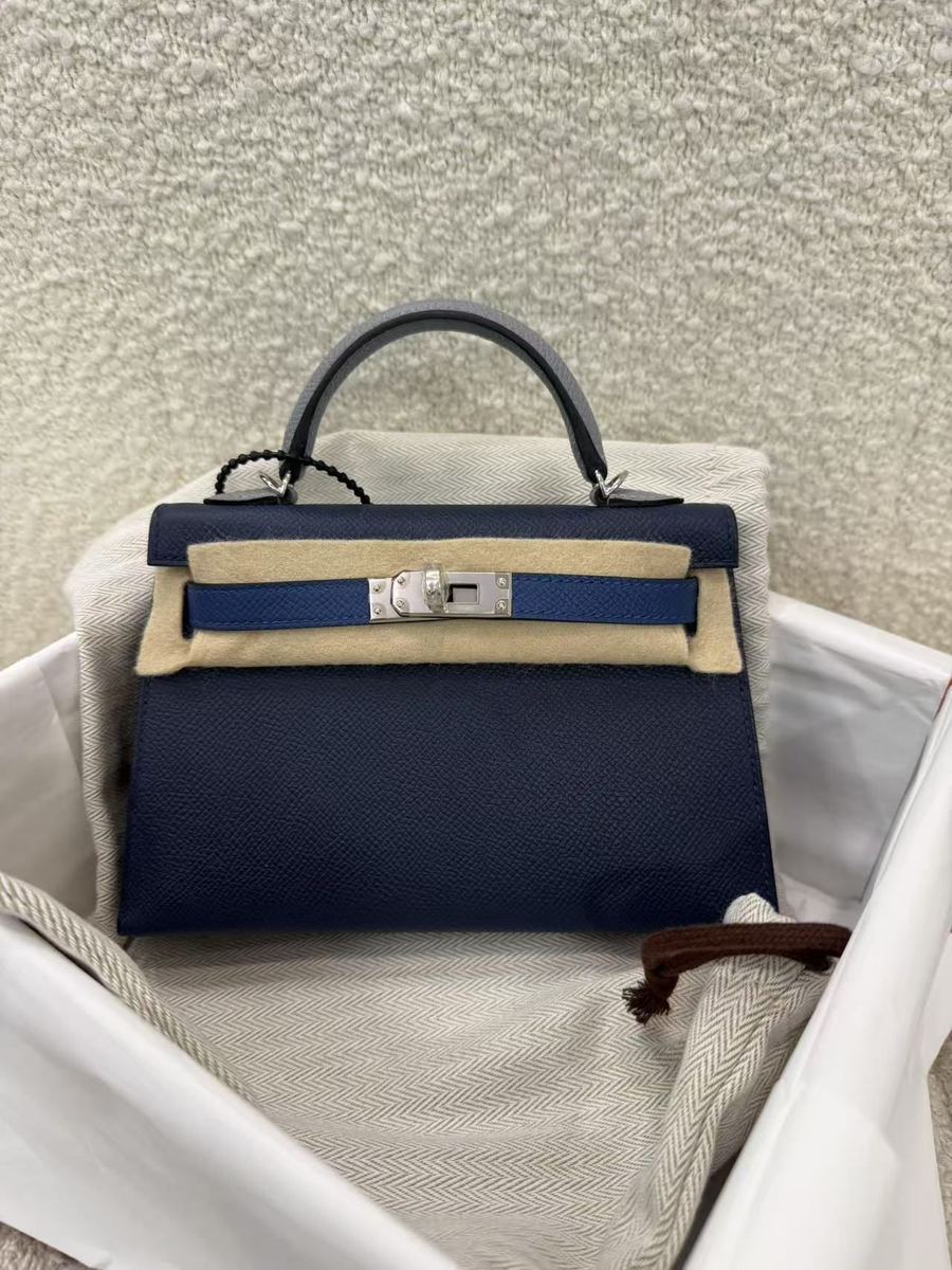 A navy Hermès Mini Kelly with palladium hardware